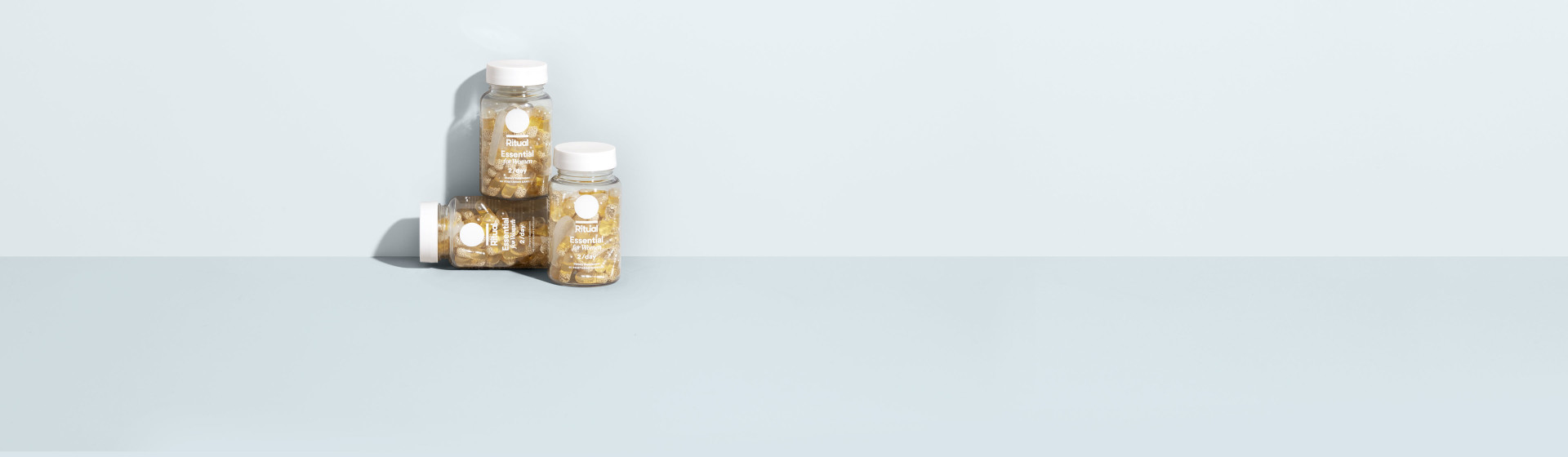 3 Ritual Multivitamin bottles stacked on top of each other.